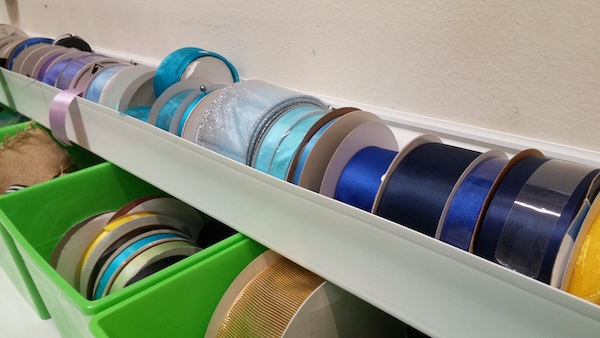 Ribbon rack made from a rain gutter.