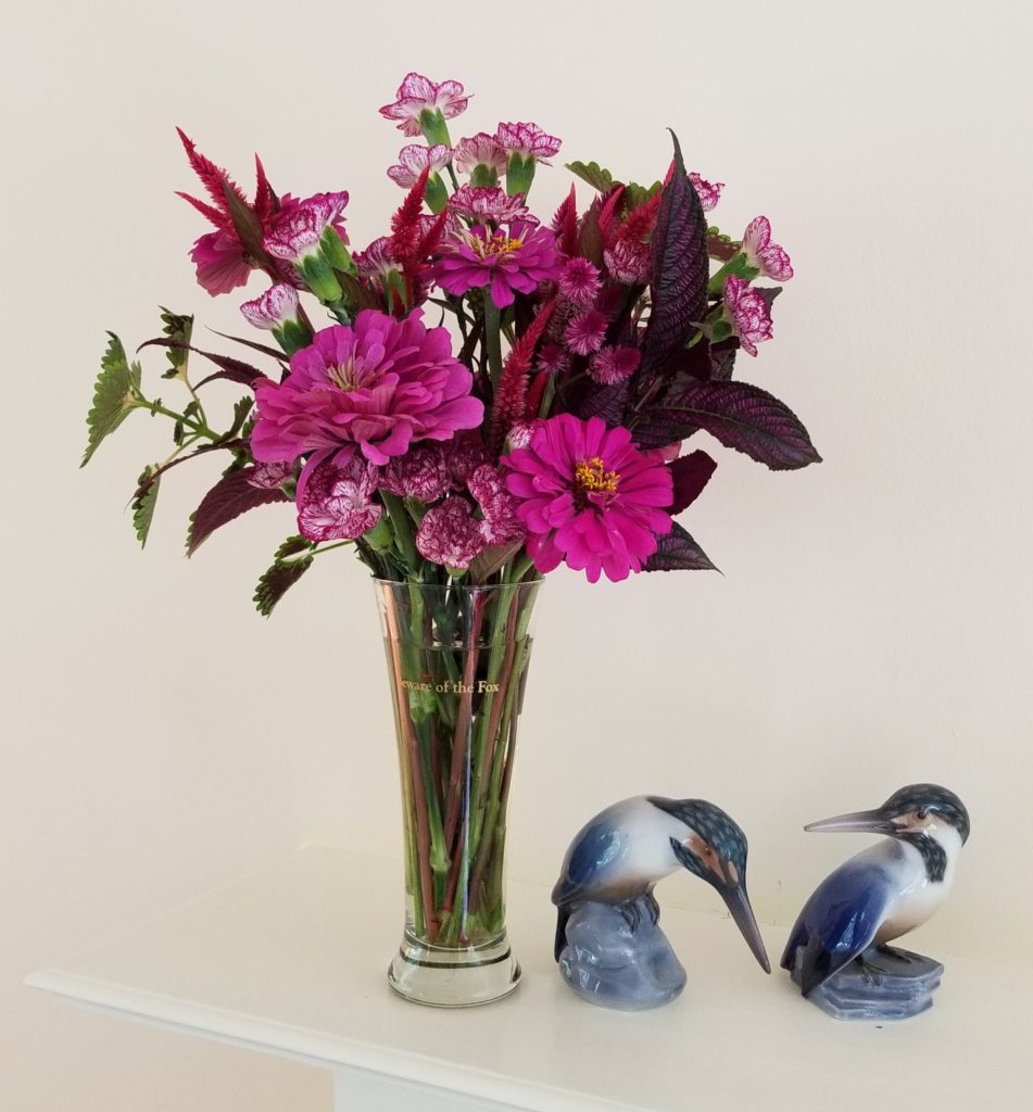 Pilsner glass magenta flower floral design by Flower Duet.