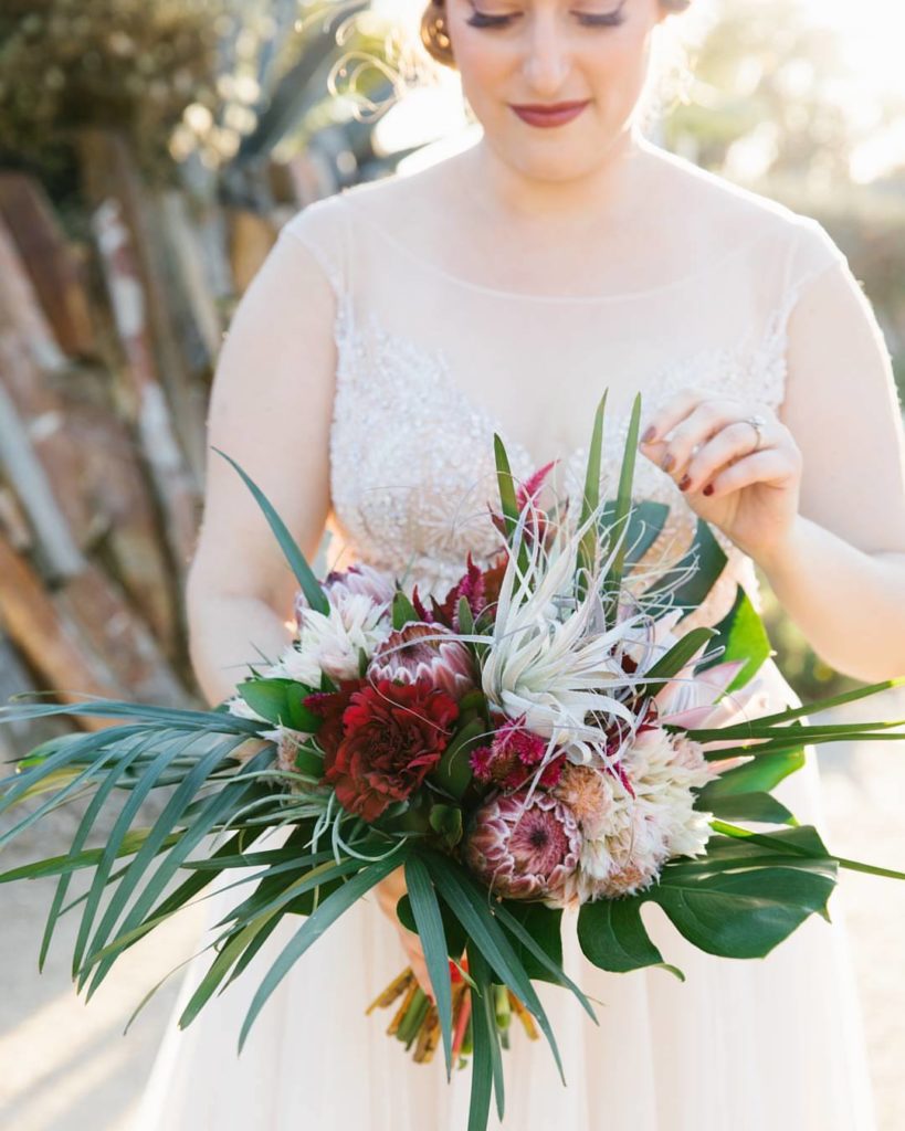 Protea and Tillandsia are stars in this bouquet