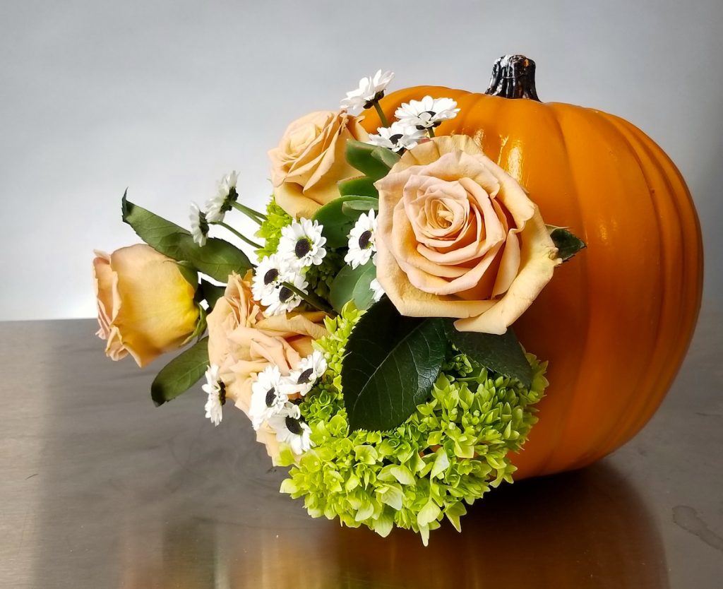 Side view of Diorama floral pumpkin. Flowers by Flower Duet. Photo by Kit Wertz.