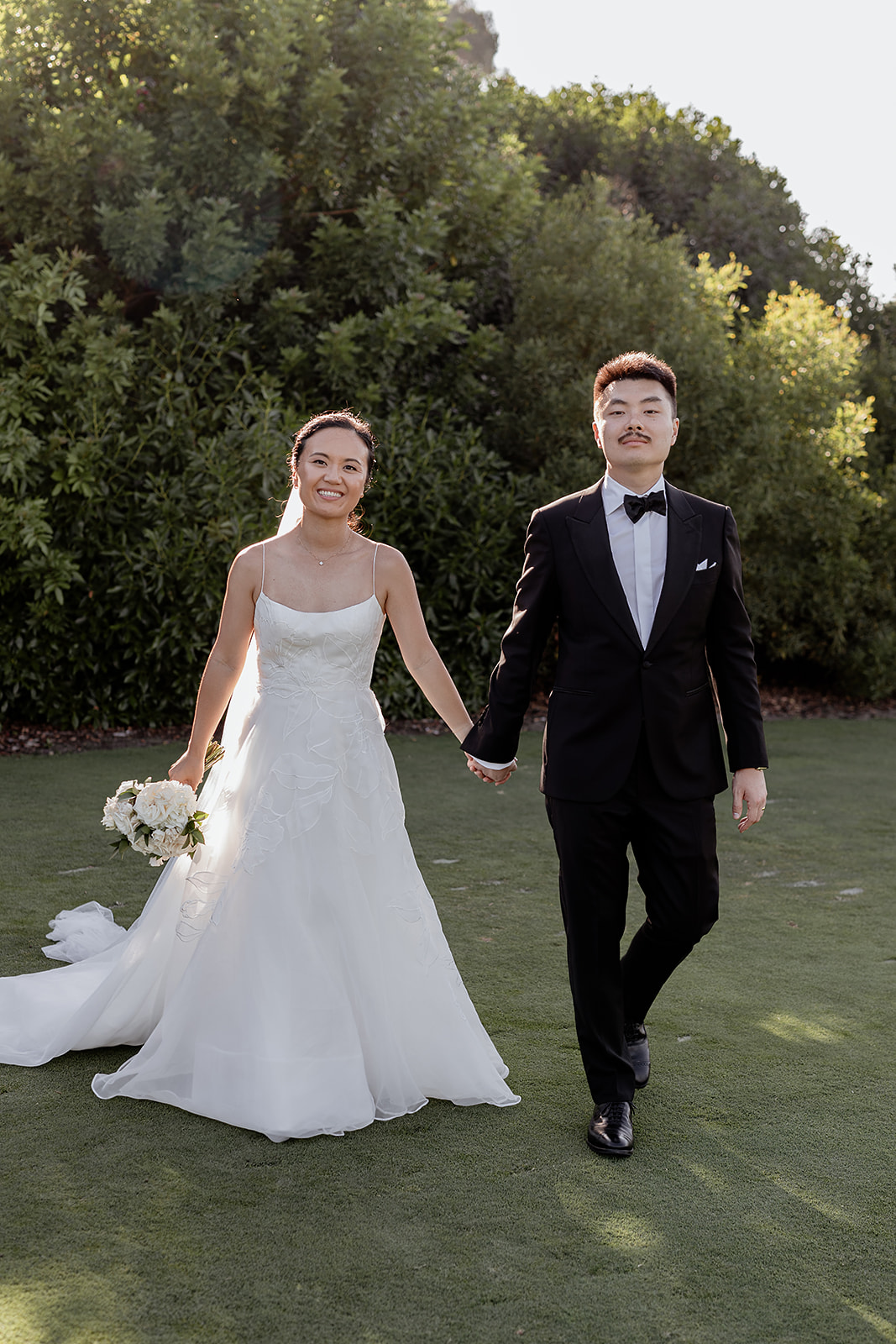 Anni and Steve Walking with bridal bouquet