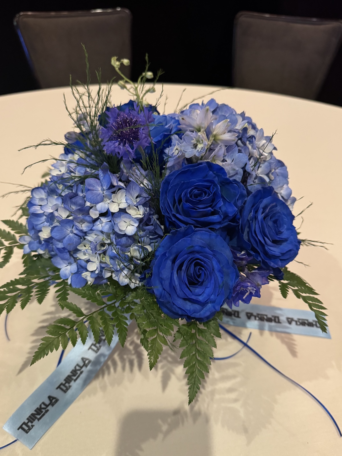 Blue flowers to match blue logo by Flower Duet